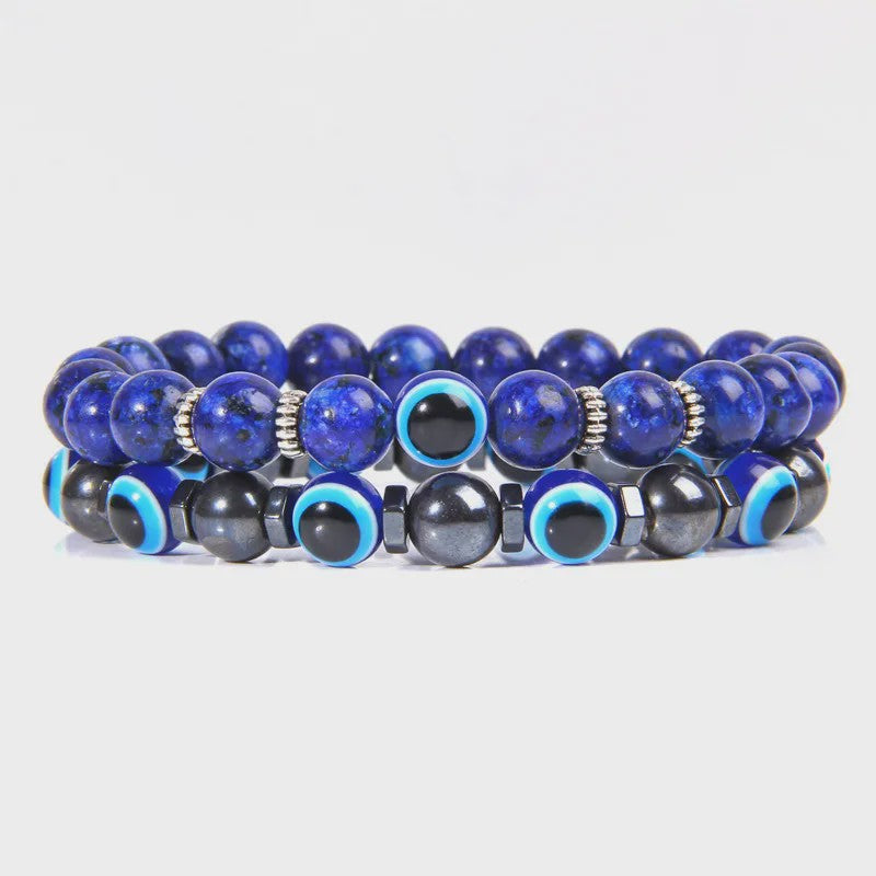 Set van 2 Handgemaakte Natuursteen Armbanden met Hanger Oog van Fatima & Lavasteen/Hematiet
