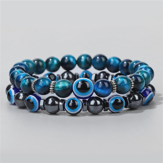 Set van 2 Handgemaakte Natuursteen Armbanden met Hanger Oog van Fatima & Lavasteen/Hematiet