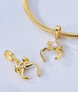 925 Sterling Zilveren Bedel: Gouden Strik met Roze Hart & Kruis met Oog van Horus