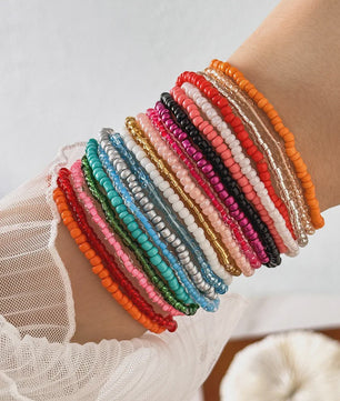Set van 7 Elastische Rijstkorrel Armbanden - Handgeweven Kleurverloop & Dopamine Stijl