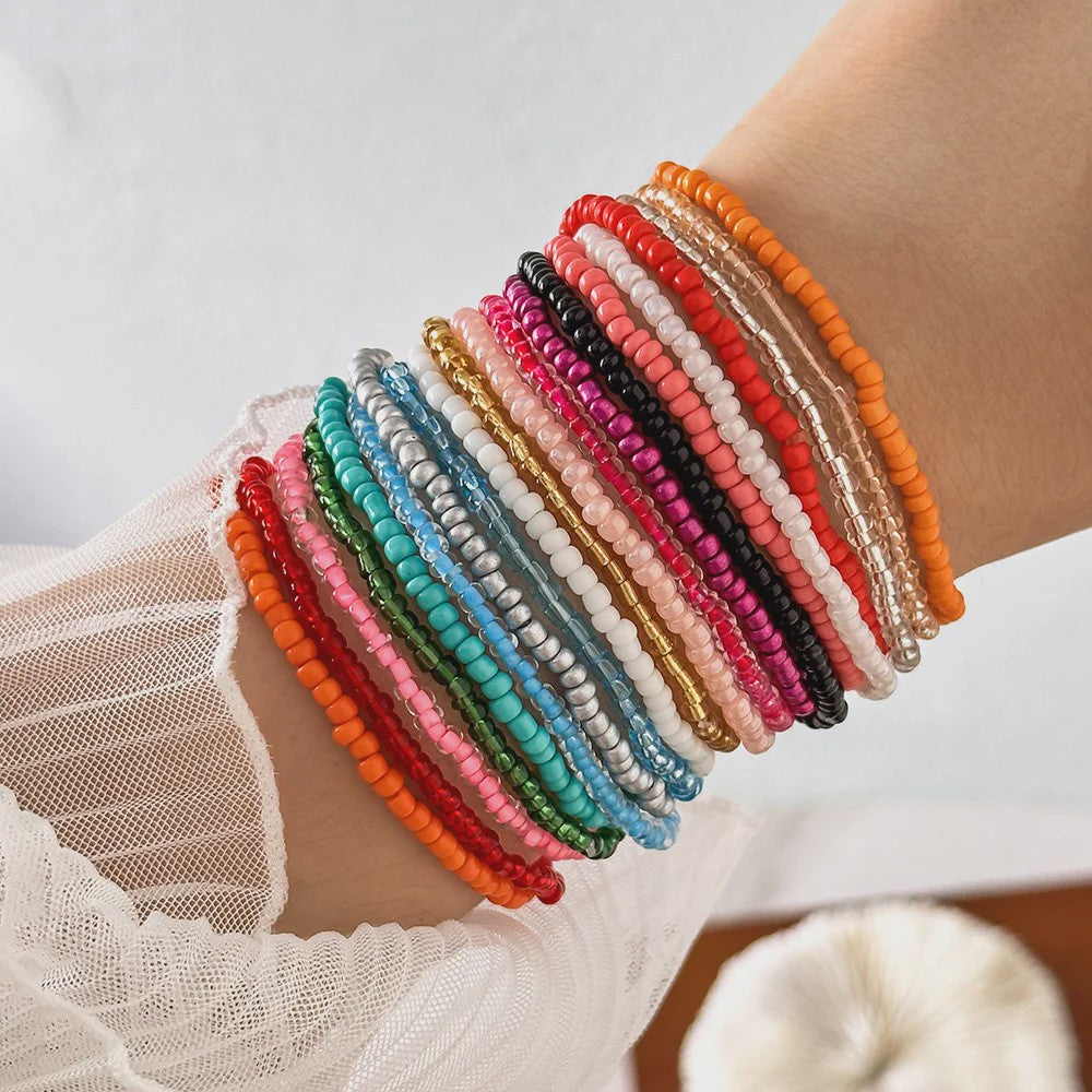 Set van 7 Elastische Rijstkorrel Armbanden - Handgeweven Kleurverloop & Dopamine Stijl