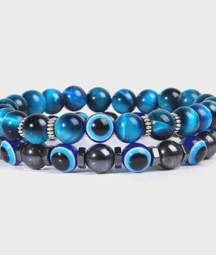 Set van 2 Handgemaakte Natuursteen Armbanden met Hanger Oog van Fatima & Lavasteen/Hematiet