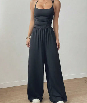 Zomerse Zwarte Jumpsuit met Losse Rechte Pijpen en Halternek