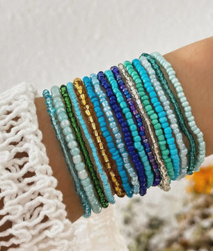 Set van 7 Elastische Rijstkorrel Armbanden - Handgeweven Kleurverloop & Dopamine Stijl