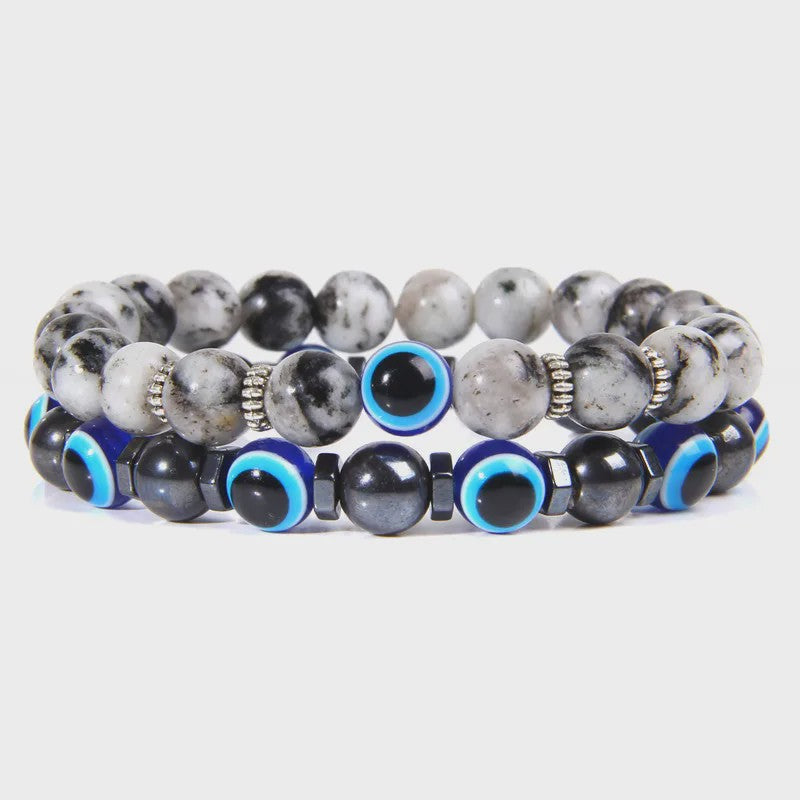 Set van 2 Handgemaakte Natuursteen Armbanden met Hanger Oog van Fatima & Lavasteen/Hematiet