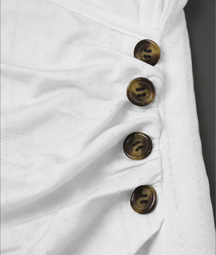 Dameswikkel T-shirt met korte mouwen en knoopdetails
