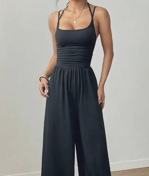 Zomerse Zwarte Jumpsuit met Losse Rechte Pijpen en Halternek